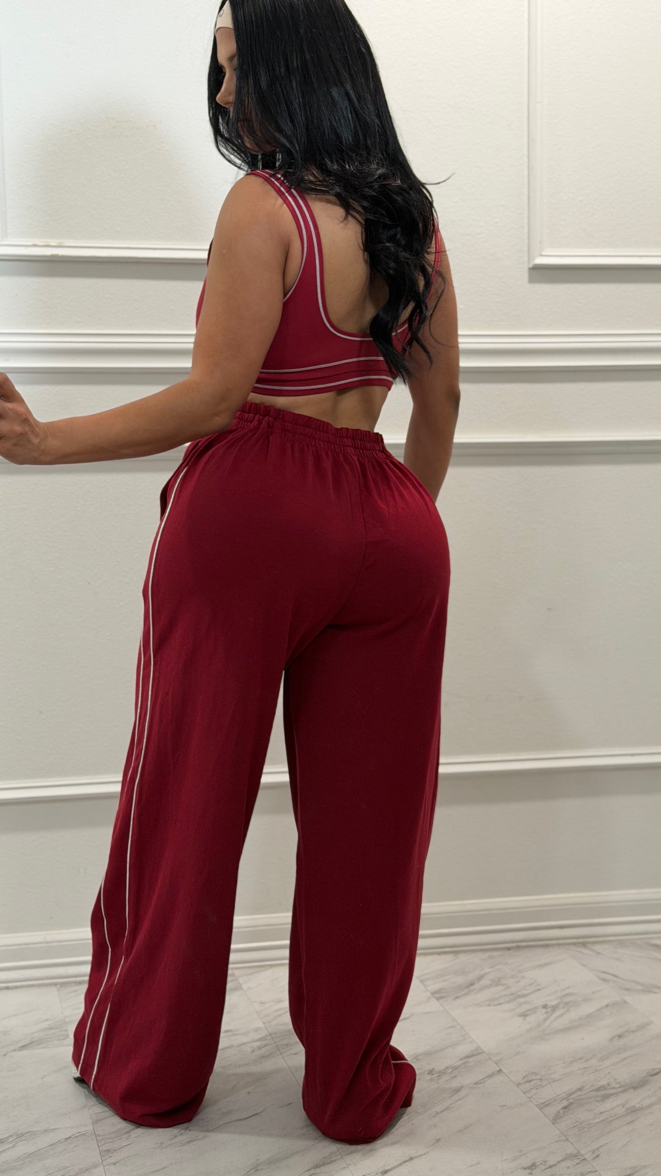 Burgundy pants and sport bra